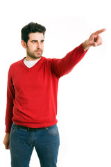 Naklejka premium Young man pointing, isolated on white