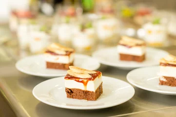 Fotobehang Banana dessert cake piece on white plate © CandyBox Images