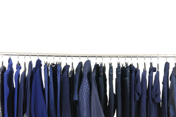 A row of designer fashion clothing hanging on hangers