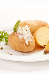 Baked potato filled with soft cheese