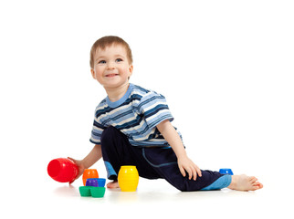 kid playing on floor on white background
