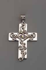 Silver cross on gray