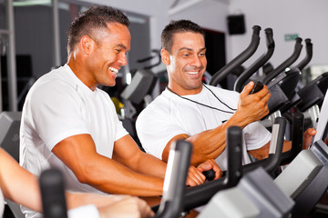 fitness man and personal trainer in gym