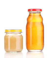 Jar of baby puree and juice isolated on white
