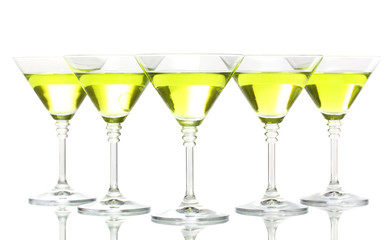 Yellow cocktail in martini glasses isolated on white