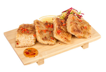 Fried fish fillets with  salad.