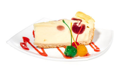 Closeup of a slice of cherry cheesecake on a white background