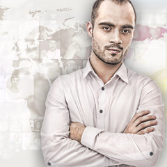Portrait of young businessman. Standing against world map with p