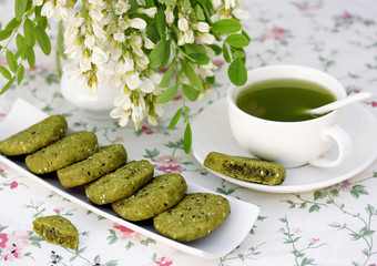 Green tea and cookies with powder matcha - obrazy, fototapety, plakaty