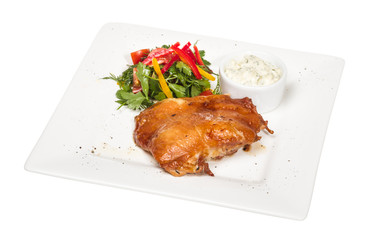 roasted chicken with vegetables on a white plate