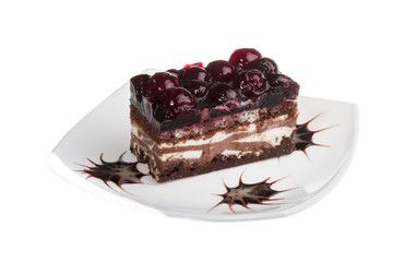 Chocolate cake with cherry on top on a white background