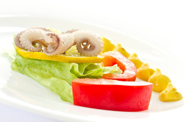 boiled octopus with lemon slice