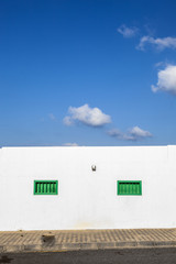 Obraz premium facade of mediterranean house with closed shutterblinds