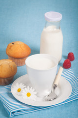 Healthy nutrition with fresh milk and chocolate muffin.