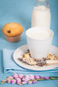 Healthy nutrition with fresh milk and a chocolate muffin.