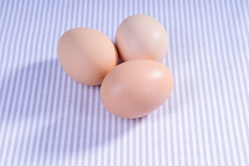 three chicken eggs