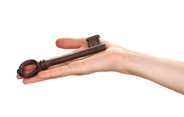 woman's hand holding an antique key on white background