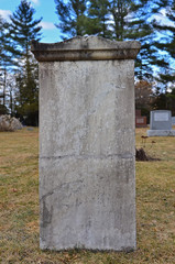 Fototapeta na wymiar A cracked tombstone