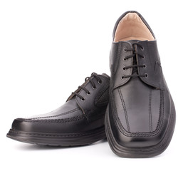 Black glossy man’s shoes with shoelaces
