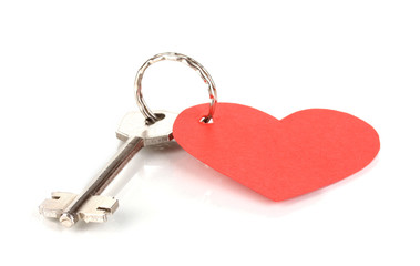 Key with heart-shaped charm isolated on white