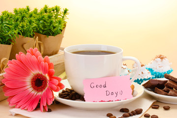 cup of coffee and gerbera  beans, cinnamon sticks
