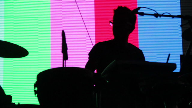 Silhouette of musician playing drums