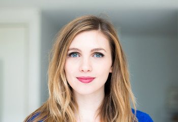 Naklejka premium smiling young attractive woman
