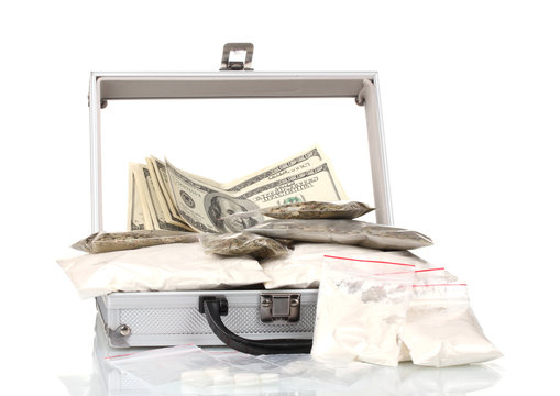 Cocaine and marijuana in a suitcase isolated on white