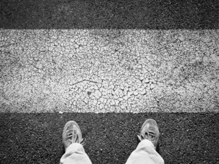 Zebra crossing and pedestrian feet