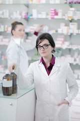 team of pharmacist chemist woman  in pharmacy drugstore