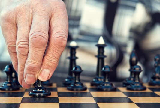 Old Man Playing Chess