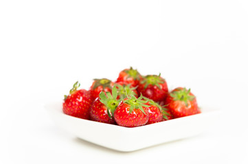 Fresh Strawberries in a bowl, isolated on white