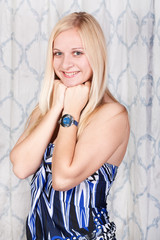 Cheerful young girl in a dress