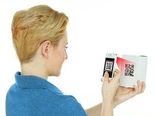 Woman scans a scancode with her white cellphone