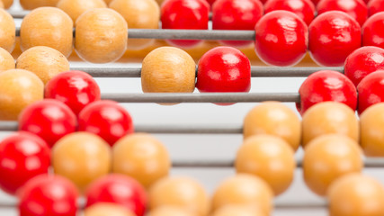 Close-up of an old abacus on a grey background