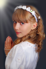 girl going to the first holy communion