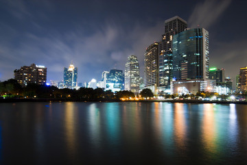 Fototapeta na wymiar Bangkok city downtown at night with reflection of skyline, Bangk