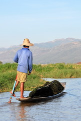 Inle Lake, Myanmar. Intha people leg-rowing style fishing