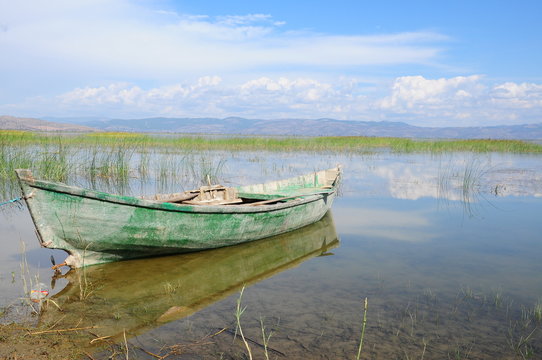 wooden kayak on lake