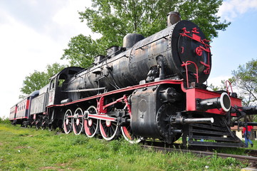 Fototapeta na wymiar black locomotive (train) on railway