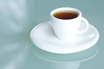 cup of tea on a glass surface