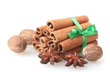 Fototapeta na wymiar Cinnamon sticks, nutmeg and anise isolated on white