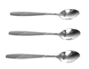 Three silver spoons isolated on white