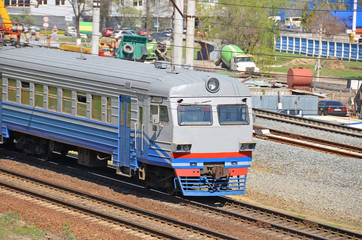 Suburban electric train locomotive in industrial zone