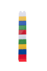 Fototapeta na wymiar Colorful stack of plastic bricks. Isolated on white.