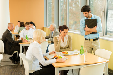 Fototapeta premium Lunch break office colleagues eat salad cafeteria