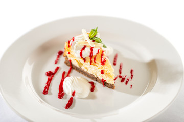 Delicious cheesecake with raspberry sauce