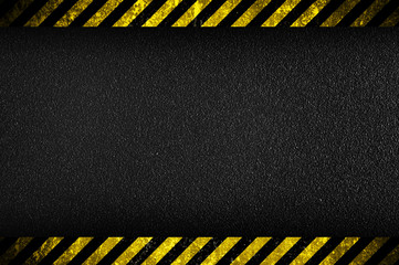 Dark background with yellow caution stripes