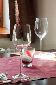 Wine glasses on the table with candle