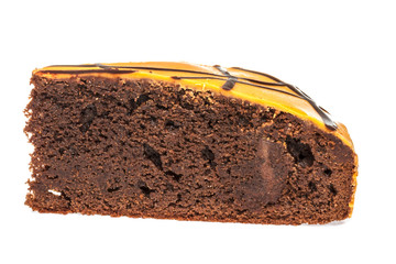 Piece of chocolate cake with icing on white isolated background